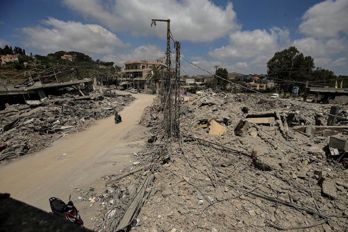 June 23, 2026, Mayfadoun, Mayfadoun, Lebanon: A motorist drives between rubble of buildings that were demolished by Israeli air strikes in the southern Lebanese village of Mayfadoun. Scores of Lebanese who fled their villages started to return to face a d