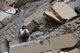 LA GUAIRA, June 29, 2026  -- A woman sits on the rubble of a collapsed building in Caraballeda, La Guaira state, Venezuela, June 28, 2026. Venezuelan National Assembly President Jorge Rodriguez said Sunday that the death toll from two powerful earthquakes