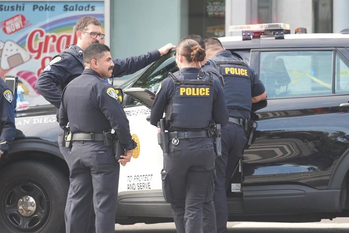 June 23, 2026, San Diego, California, United States: Police officers investigate at the scene after the shooting. San Diego police officers and firefighters respond to the Cedar Gateway apartment complex at Sixth Avenue and Cedar Street in the Cortez Hill
