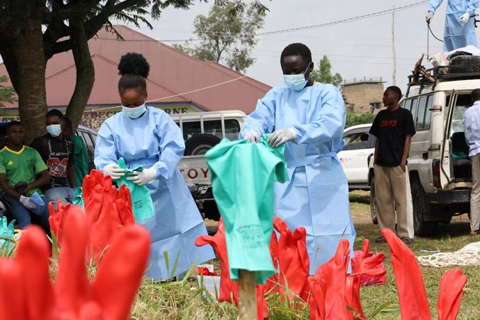 RWAMPARA, June 16, 2026  -- Health workers dry disinfected gloves at an Ebola treatment center in Rwampara in eastern Democratic Republic of the Congo, on June 16, 2026. The number of confirmed Ebola cases in the Democratic Republic of the Congo has risen
