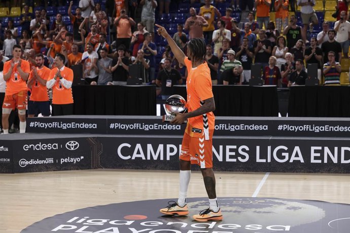 Jean Montero of Valencia Basket pose with the trophy after the Spanish League, Liga ACB Endesa, basketball Final Game 4 match played between FC Barcelona and Valencia Basket at Palau Blaugrana on June 24, 2026 in Barcelona, Spain.