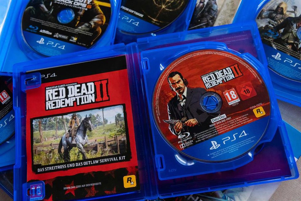July 2, 2026, Yokohama, Kanagawa, Japan: Open cases with physical discs of PlayStation 4 games. 