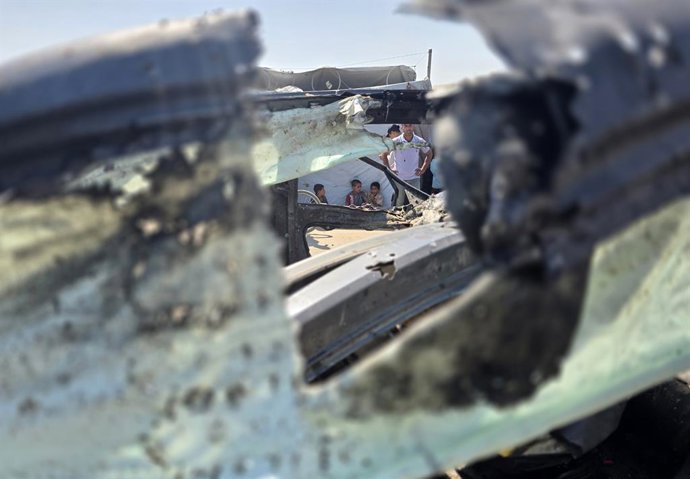 July 6, 2026, Khan Yunis, Gaza Strip, Palestinian Territory: Palestinians inspect the damage caused by an Israeli airstrike on a vehicle near a camp for displaced people in Khan Younis, southern Gaza Strip, on July 6, 2026. According to medical sources, t