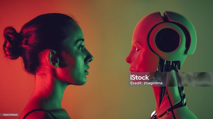 Robot and young woman face to face.