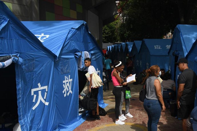 LA GUAIRA, July 12, 2026  -- People affected by two earthquakes are seen at a temporary camp set up with tents donated by China, in Catia la Mar, La Guaira state, Venezuela, on July 10, 2026. On the streets of Catia la Mar, a coastal town in La Guaira sta