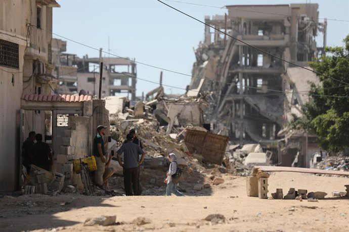 July 12, 2026, Gaza, Gaza Strip, Palestinian Territory: Palestinians inspect the damage at the site of an Israeli airstrike that targeted a blacksmith workshop in the al-Sabra neighborhood of Gaza City, on July 12, 2026, as Civil Defense firefighters atte