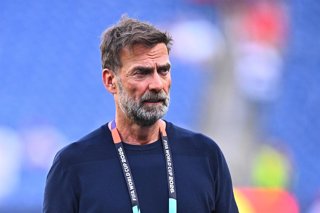 09 July 2026, US, Foxborough: Juergen Klopp, TV analyst for MagentaTV, reacts after the 2026 FIFA World Cup quarter-final match between France and Morocco at Boston Stadium. Photo: Tom Weller/dpa - PLEASE NOTE: In accordance with FIFA regulations, these i