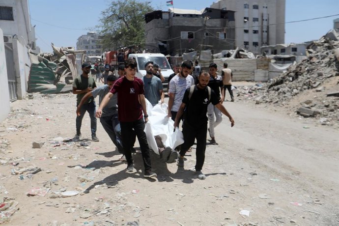 July 14, 2026, Gaza City, Gaza Strip, Palestinian Territory: Mourners bid farewell to the bodies of six Palestinian police officers at al-Shifa Hospital in Gaza City on July 14, 2026. The officers were killed in an Israeli airstrike that targeted a Palest