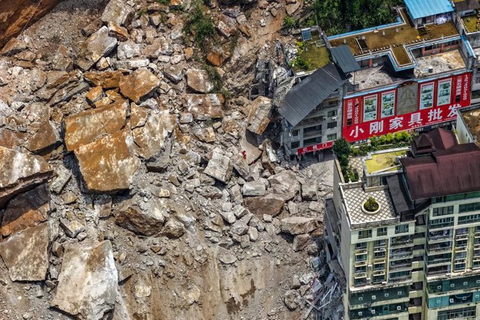 CHONGQING, July 17, 2026  -- An aerial drone photo taken on July 17, 2026 shows the site of a rainfall-induced landslide along a section of the Wujiang River in southwest China's Chongqing Municipality. Nine people have so far been rescued after a rainfal