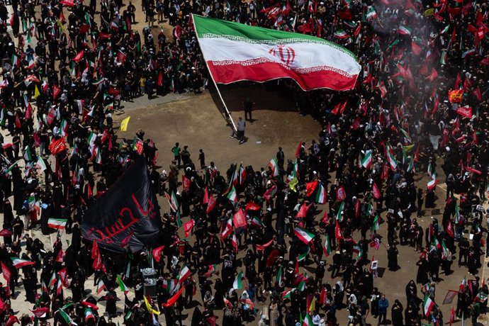July 6, 2026, Tehran, Tehran, Iran: Mourners carrying Iranian and religious flags gather during the funeral procession of the late Iranian Supreme Leader Ayatollah Ali Khamenei in Tehran, Iran, Monday, July 6, 2026.