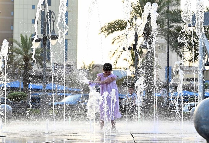 KUWAIT CITY, July 12, 2026  -- A girl plays in a fountain to cool off at the old market in Kuwait City, Kuwait, July 11, 2026.