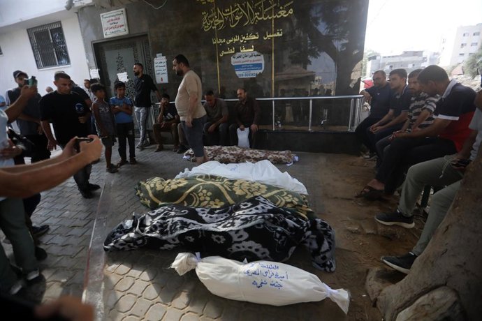 July 21, 2026, Gaza City, Gaza Strip, Palestinian Territory: Mourners bid farewell to the bodies of Firas al-Masri, his wife, and their four children after they were killed in an Israeli airstrike that targeted a house belonging to the al-Masri family on 