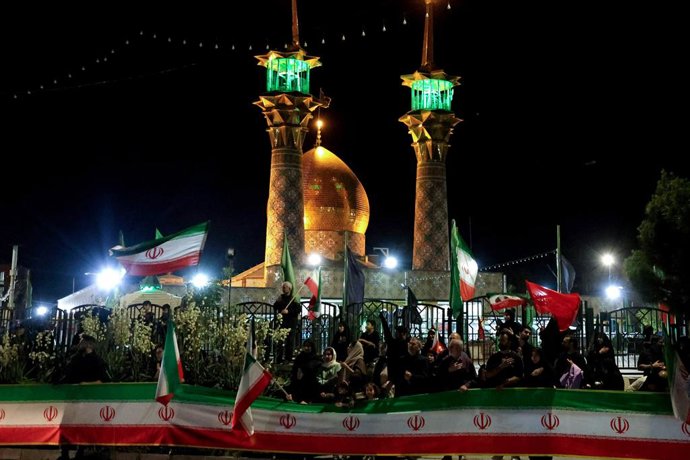 June 23, 2026, Tehran, Iran: Supporters gather with Iranian flags outside a shrine during a state-organized rally in Iran. The rally followed the June 18 signing of an interim memorandum of understanding by U.S. President Donald Trump and Iranian Presiden