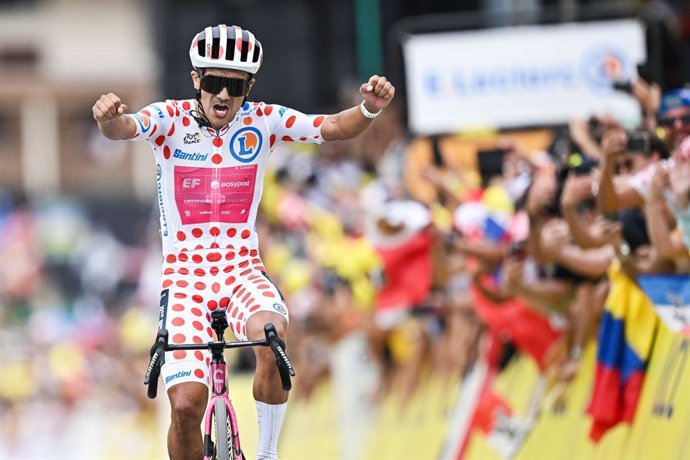 Ecuadorian Richard Carapaz of EF Education-EasyPost celebrates as he crosses the finish line to win stage 20 of the 2026 Tour de France cycling race, a stage of 171km Le Bourg d'Oisans to Alpe d'Huez, on Saturday 25 July 2026. The 113th edition of the Tou