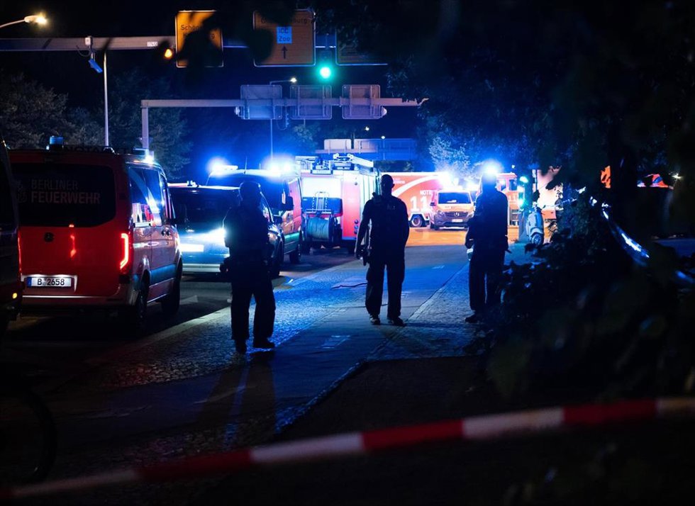BERLIN, July 26, 2026 -- Police officers work near the site where a car drove into a crowd in Berlin, Germany, July 26, 2026. One person was killed and 16 others were injured, including several with life-threatening injuries, after a car drove into a cro