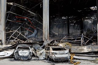 July 19, 2026, Kyiv Region, Ukraine: Burnt-out cars are outside a warehouse complex of the AMTEL distribution centre that caught fire as a result of a Russian missile strike, Kyiv region, Ukraine, July 19, 2026. On Sunday night, July 19, the Russian army 