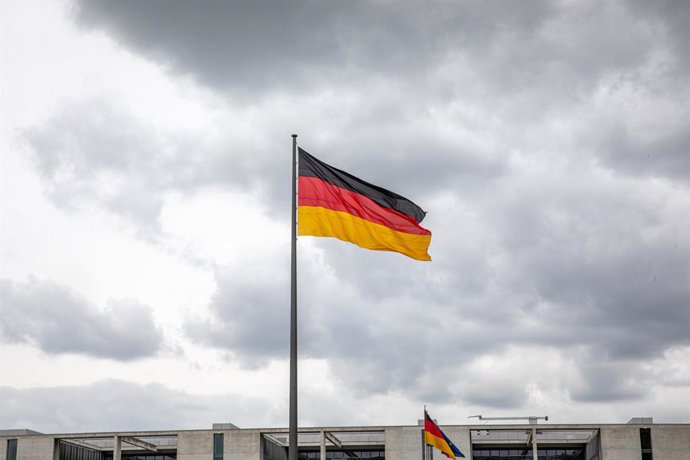 July 4, 2026, Berlin, Berlin, Germany: A German flag flies above the Reichstag building in Berlin, Germany, on Saturday, July 4, 2026. The Reichstag is home to Germany's lower house of parliament, the Bundestag.