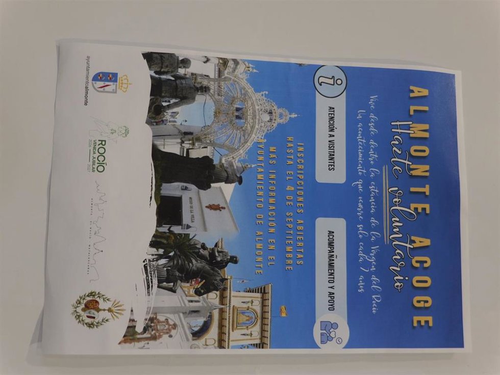 Cartel de 'Almonte Acoge'.