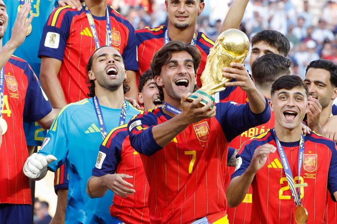 Winning goal scorer Ferran Torres #7 of Spain lifts the trophy following the FIFA World Cup 2026 Final football match between Spain and Argentina on July 19, 2026 at New York New Jersey Stadium, MetLife Stadium in East Rutherford, New Jersey, United State