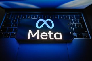 July 15, 2026, Poland: In this photo illustration, the Meta logo is seen displayed on a smartphone on the top of a laptop.