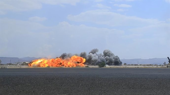 BEIJING, July 14, 2026  -- Smoke rises after airstrikes on Sanaa International Airport in Sanaa, Yemen, July 13, 2026. Houthi-run Al-Masirah TV said Monday Saudi Arabia launched several airstrikes on the runways of Sanaa International Airport in the Houth