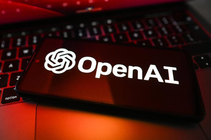 Archivo - May 4, 2026, Poland: In this photo illustration, an OpenAI logo is displayed on a smartphone on top of a laptop.