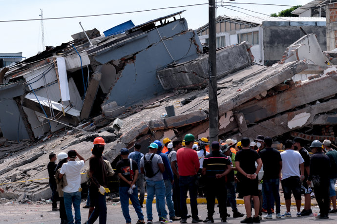 August 12, 2026, Cali, Valle Del Cauca, Colombia: People gather outside collapsed buildings in Cali, Colombia on August 12, 2026 to aid in several rescue labors after a 7,4 magnitude earthquake that struck the cities of Quibdo, Cali, Pereira and Manizales