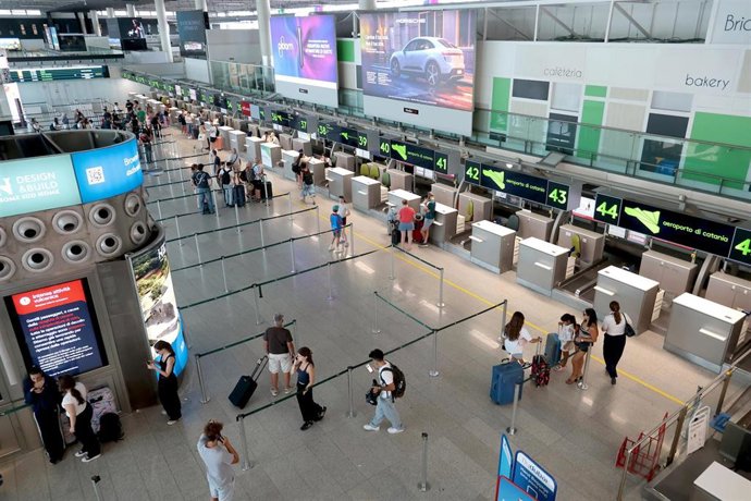 12 August 2026, Italy, Catania: Passengers can be seen at the Catania airport. Due to the ash clouds, flight operations at the Catania airport, located near Mount Etna, have been suspended. Photo: Davide Anastasi/LaPresse via ZUMA Press/dpa