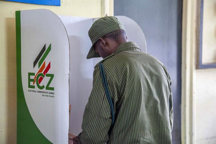 LUSAKA, Aug. 13, 2026  -- A voter marks a ballot paper at a polling station in Lusaka, Zambia, on Aug. 13, 2026. Zambian voters turned out in large numbers on Thursday to cast their ballots in the general elections amid a largely peaceful atmosphere.