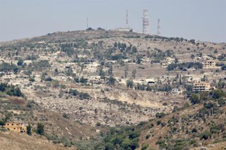 HOULA, Aug. 12, 2026  -- This photo taken on Aug. 11, 2026 from the village of Chaqra shows destruction caused by Israeli attacks in the border village of Houla in Lebanon.