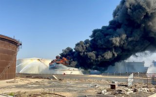 TRIPOLI, Aug. 11, 2026  -- This photo taken with a mobile phone shows a fuel tank still burning at the Zawiya oil refinery in Zawiya, western Libya, Aug. 11, 2026. Libya's National Oil Corporation (NOC) on Monday night said in a statement that a fuel tank