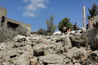 August 15, 2026, Ansar, Ansar, Lebanon: People inspect destruction caused by an Israeli air strike in the southern Lebanese village of Ansar. Seven people were killed and three other wounded in the attack, one of the deadliest attacks since a precarious t