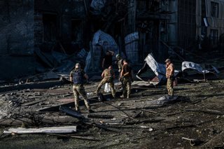 August 11, 2026, Zaporizhzhia, Ukraine: Specialists collect debris for forensic examination and document evidence of a war crime at the site of a Russian missile impact near the State Center for Standardization, Metrology and Certification, Zaporizhzhia, 