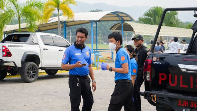 Responders are seen after a shooting incident at a school in Zamboanga City, the Philippines, Aug. 18, 2026.