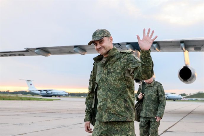 RUSSIA, MOSCOW REGION - JUNE 26, 2026: A Russian serviceman released from Ukrainian captivity waves after disembarking from an aircraft