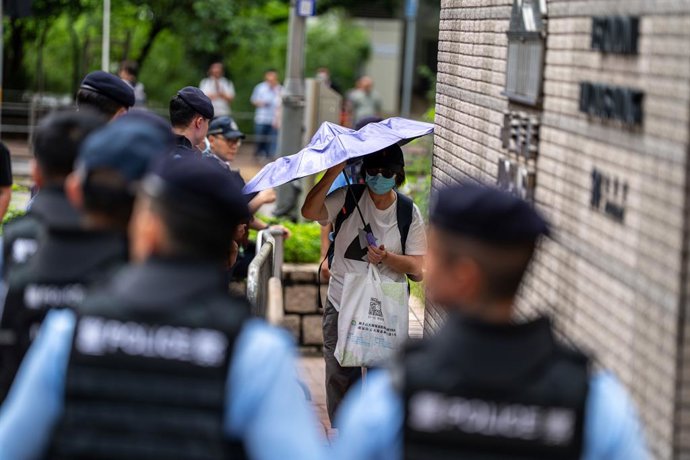 August 21, 2026, Hong Kong, HONG KONG: Police officers standing guard outside the West Kowloon Magistrates Courts before the court hands down the verdict on the Tiananmen Vigil Organizers on August 20, 2026 in Hong Kong. A Hong Kong court today founded th