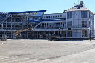 August 22, 2026, Odesa Region, Ukraine: Municipal workers use a boom lift to remove broken construction from the facade of the Rozdilna railway station building, damaged by a nighttime Russian drone attack, Odesa region, Ukraine, August 22, 2026. The dron