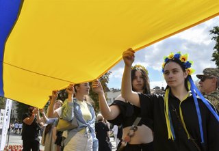 August 23, 2026, Lviv, Ukraine: Ukrainians march while holding the national flag during the celebration. Ukrainians hold national flag a 35-meter long during a public event to mark National Flag Day in Lviv, western Ukraine. National Flag Day is celebrate