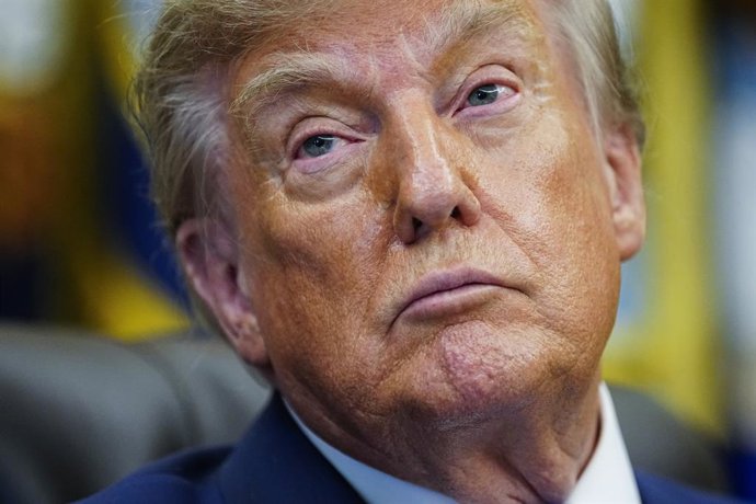 8/10/2026 - Washington, District of Columbia, United States of America: United States President Donald J Trump listens prior to signing an executive order that reevaluates childhood vaccines in the Oval Office of the White House in Washington, DC, USA, on