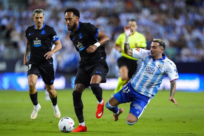 Joaquin Munoz of Malaga CF and Pierre-Emerick Aubameyang of RC Deportivo in action during the Spanish league, LaLiga EA Sports, football match played between Malaga CF and RC Deportivo at La Rosaleda stadium on August 24, 2026, in Malaga, Spain.