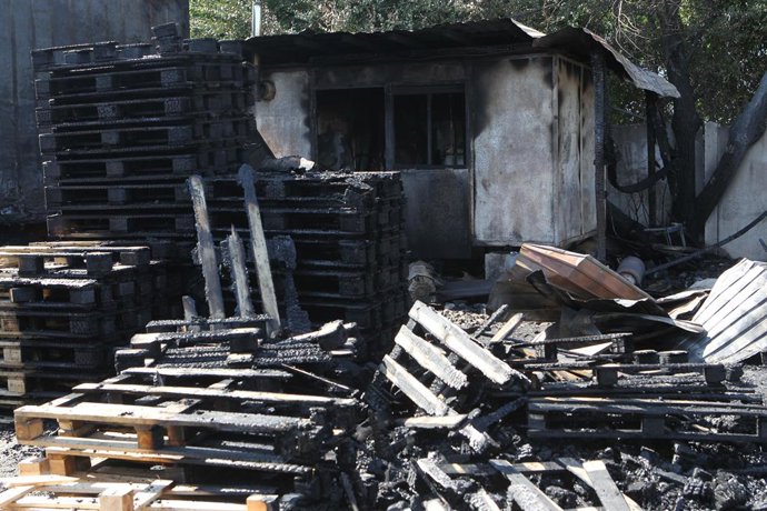 August 25, 2026, Dnipro, Ukraine: Burnt wooden pallets that caught fire as a result of a nighttime Russian UAV attack are in a parking lot near a shopping and entertainment centre in Dnipro, Ukraine, August 25, 2026. Fires broke out inside and near the sh