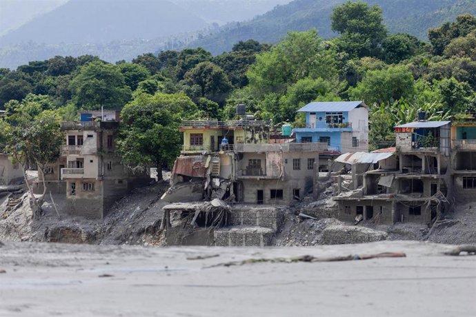 NUWAKOT, Aug. 27, 2026  -- This photo taken on Aug. 27, 2026 shows destroyed buildings along the Trishuli River after a massive flash flood in Nuwakot, Nepal. Nepal's National Disaster Risk Reduction Management Authority said that as many as 359 bodies ha