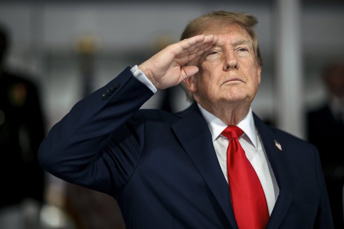 August 24, 2026, Washington, Dc, United States: U.S. President Donald Trump, salutes during the national anthem before the start of the Freedom 250 Grand Prix Race, August 23, 2026 in Washington, D.C.