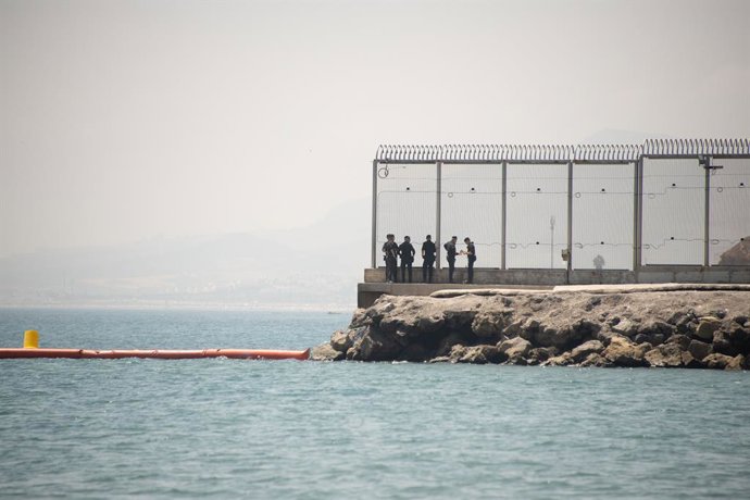 CEUTA, Aug. 15, 2026  -- Security personnel work at the border of Ceuta, Spain, Aug. 15, 2026. More than 72,000 migrants crossed irregularly into Ceuta from neighboring Morocco on July 30 and 31, according to the Spanish government. Most returned to Moroc