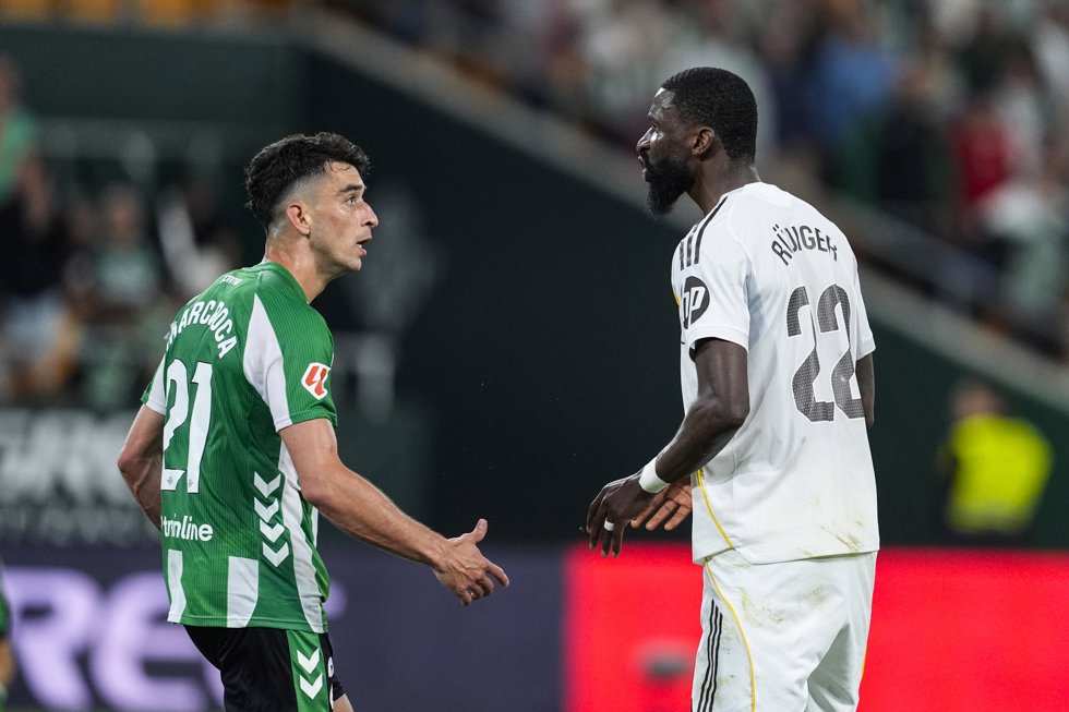 Marc Roca of Real Betis and Antonio Rudiger of Real Madrid gestures during the Spanish league, LaLiga EA Sports, football match played between Real Betis and Real Madrid at La Cartuja stadium on April 24, 2026, in Sevilla, Spain.