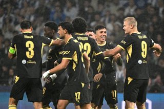 08 September 2026, Portugal, Porto: Manchester City's Erling Haaland (R) celebrates scoring his side's first goal with teammates during the UEFA Champions League group stage soccer match between Porto and Manchester City at the Estadio do Dragao. Photo: Z