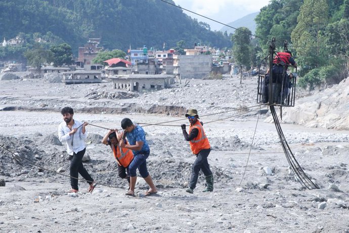 September 7, 2026, Nuwakot, Nepal: NUWAKOT, NEPAL â€” 7 Sep 2026: Nepal Police have been deployed to Devighat and Trishuli to facilitate safer passage for residents crossing the river via tuin (rope bridges) after severe Bhote Koshi flooding swept away th