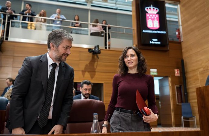 Archivo - La presidenta de la Comunidad de Madrid, Isabel Díaz Ayuso, y el consejero de Presidencia, Justicia y Administración Local, y portavoz del Gobierno autonómico, Miguel Ángel García Martín, durante un pleno en la Asamblea de Madrid