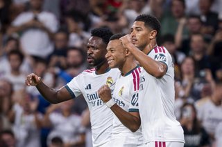 12 September 2026, Spain, Madrid: Real Madrid's Kylian Mbappe celebrates scoring his side's first goal with teammates Vinicius Junior (L) and Jude Bellingham during the Spanish Primera Division soccer match between Ral Madrid and Rayo Vallecano de Madrid 