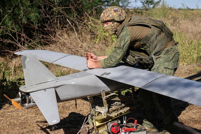 RUSSIA, KHERSON REGION - SEPTEMBER 9, 2026: A serviceman with the military intelligence brigade's unmanned systems unit from the 18th Combined Arms Army of the Dnepr Group of Forces is seen by a Merlin VR reconnaissance drone during the special military o